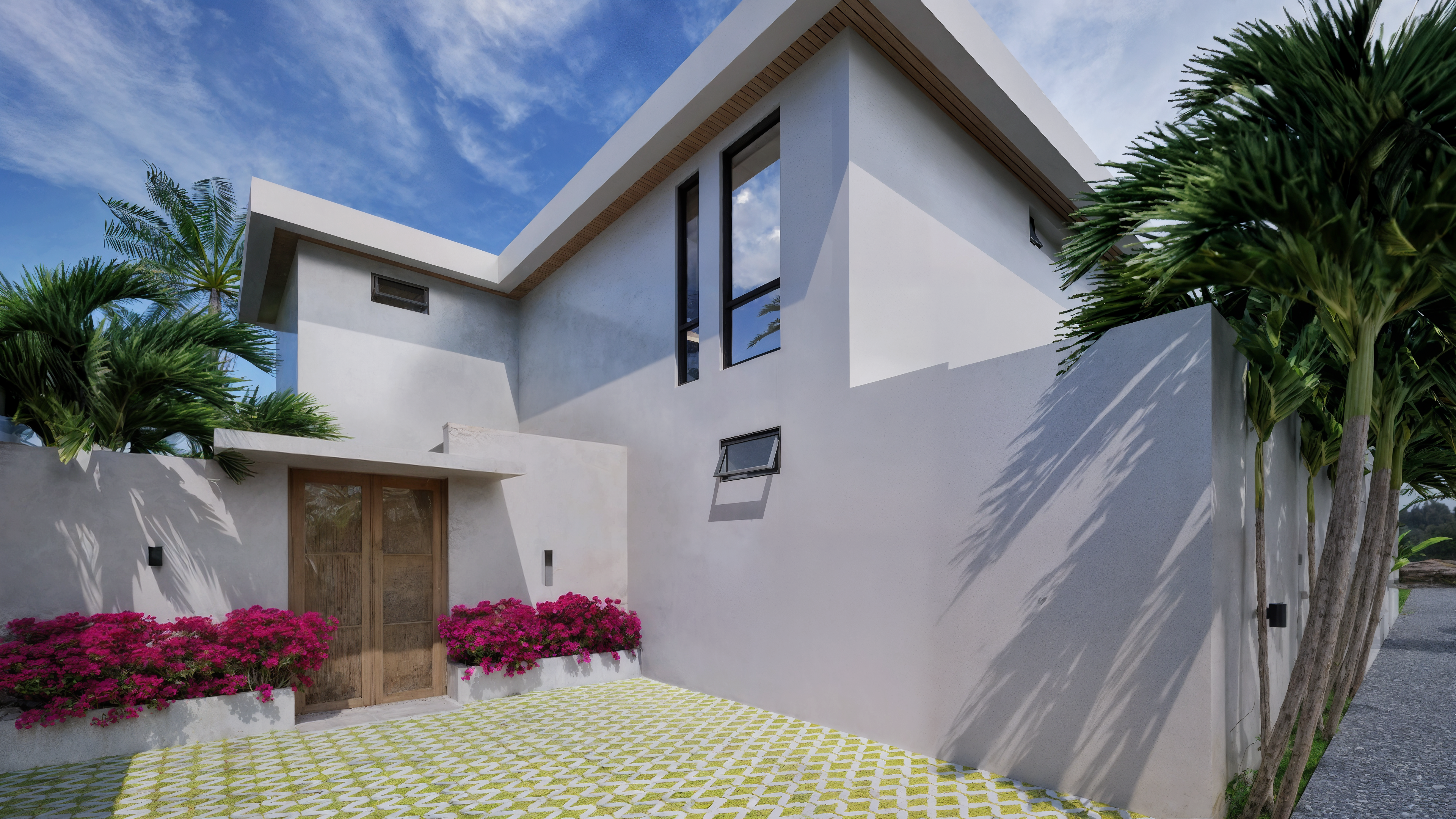 Villa entrance — stone wall and bougainvillea